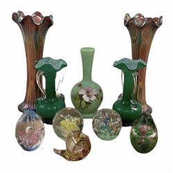 Five modern glass paper weights, together with a painted glass vase and two pairs of glass vases 