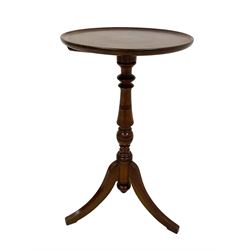 Late 19th century walnut wine table, the dished top raised on turned column with tripod sabre supports 