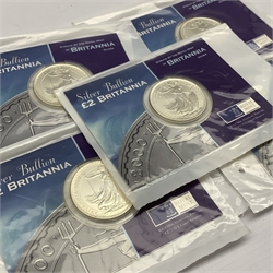 Five one ounce fine silver Britannia coins, all dated 2000 on display cards
