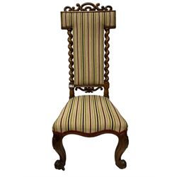 Victorian walnut prie-dieu chair, c-scroll carved cresting rail over spiral turned uprights, back and seat upholstered in striped fabric, raised on cabriole supports with cartouche carved knees and scrolled feet on brass castors