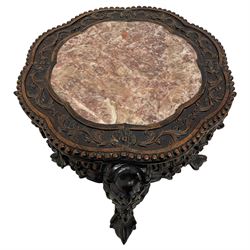 Small late 19th to early 20th century carved hardwood jardinière or urn stand, shaped rose marble top enclosed by bead and scrolling foliate carved surround, the frieze rails carved and pierced with flowerheads, on dragon mask carved cabriole supports with ball and claw feet