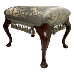 Georgian design mahogany footstool, the overstuffed seat upholstered in pale blue urn patterned fabric with fringe, raised on cabriole supports with inner c-scroll and pad feet 
Provenance: From the Estate of the late Dowager Lady St Oswald