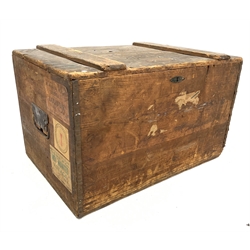 Late 19th century pine travelling trunk, with hinged lid revealing plain interior, wrought and cast iron recessed carry handles to each end, with traces of old paper labels, W81cm, H50cm, D55cm