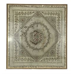 19th century Indian silk panel of geometric designwithin a floral border with silver thread, framed 83cm x 77cm