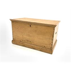 19th century pine blanket box, hinged lid revealing plain interior, with recessed brass carry handle to each end, raised on plinth base W97cm D55cm, H53cm