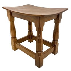 'Mouseman' oak joint stool, dished top on four octagonal supports joined by stretchers, carved with mouse signature, by Robert Thompson of Kilburn