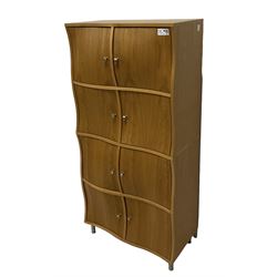 Contemporary oak wavy door cupboard, fitted with eight cupboards with convex and concave shaped facias