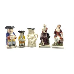 19th Century pearlware Toby jug wearing a yellow frock coat H17cm, two other toby jugs and a pair of pearlware figures ;Elijah and the Raven' and the 'Widow' H24cm