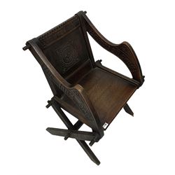 Late 19th century oak Glastonbury chair with carved inscription 