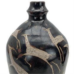 William Bower Dalton (British 1868-1965): Stoneware bottle vase, covered in a tenmoku glaze and stylized deer, inscribed WB beneath, H32cm 