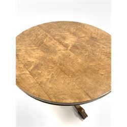 Victorian maple tilt top table by 'Chindley & Sons', circular top over turned column leading to three leaf carved splayed supports with castors D91cm, H74cm