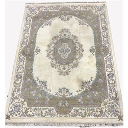 Large Chinese washed woollen ground carpet, with floral medallion on ivory field, enclosed by floral spandrels and border, 270cm x 372cm