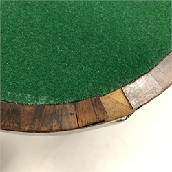 Recency mahogany fold over games table, cross banded top with string inlay lifting to reveal baize lined playing surface, frieze drawer, raised on turned and reeded supports terminating in brass castors, W100cm