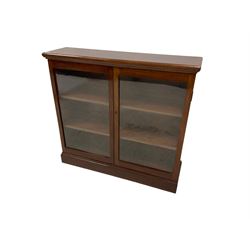 Edwardian mahogany bookcase, rectangular top over two glazed doors enclosing two adjustable shelves 