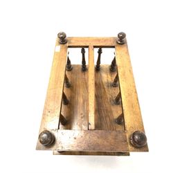 Victorian walnut two division Canterbury, spindle uprights, single frieze drawer, raised on turned supports with brass and ceramic castors W53cm