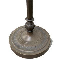 Pair of bronzed floor standing standard lamps of classical design, H166cm