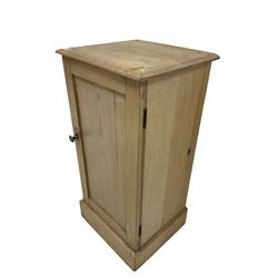Victorian pine bedside cabinet with one door opening to reveal one fixed shelf, raised on a plinth base