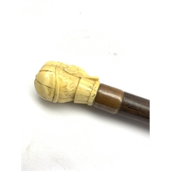 Victorian rosewood walking cane with later ivorine finial in the form of a gentleman's head wearing a monocle and cap, L86cm 
