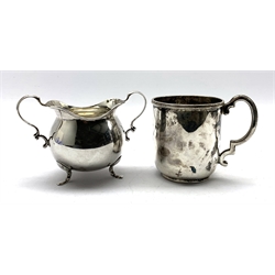 Silver christening mug engraved with a monogram and with angular handle H8cm Sheffield 1918 Maker Walker and Hall and a silver two handled sugar bowl Birmingham 1938 Maker Henry Williamson 8.8oz