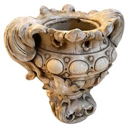 Cast plaster Cartouche urn planter, in the form of scrolling foliage with globular decorative band, on scrolled leaf cast footed base