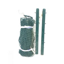 A tennis court set comprising a pair of green painted posts with brass tensioning handle, and a large net, height of post 126cm. 