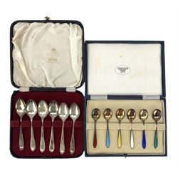 Cased set of six silver gilt coffee spoons, each with a coloured enamel stem together with a cased set of six silver teaspoons 