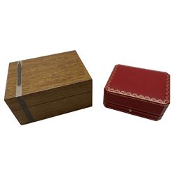 Patek Philippe wooden wooden lacquered watch box, with silvered strip to one side, embossed and gilt Patek Philippe Geneve to inner rim, magnetic closure, empty interior, together with a Cartier watch box (2)