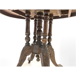 Victorian walnut oval centre table, floral inlaid marquetry to centre encircled by boxwood stringing and chequered lozenge motif, raised on cluster column supports and four splayed leaf carved legs terminating in castors, W102cm