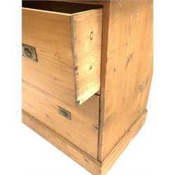 19th century pine campaign style chest, fitted with two deep drawers each with recessed brass pull handles, raised on 