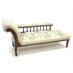 Edwardian beech framed chaise lounge, gallery back, turned supports with brass and ceramic castors, upholstered in raised floral patterned fabric, L175cm