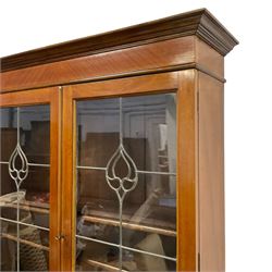 Edwardian walnut bureau bookcase, fitted with astragal leaded and glazed doors with tulip design, over fall-front with fitted interior, with three graduating drawers below, cabriole supports with ball and claw feet