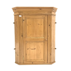   Solid pine wall hanging corner cabinet, panelled door enclosing two shaped fixed shelves, W83cm, 102cm 47cm  