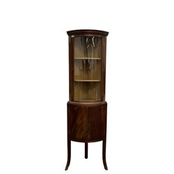 Mid to late 20th century mahogany bow front corner cabinet, glazed door over double cupboard