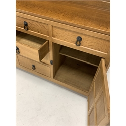 'Mouseman' 5' adzed oak dresser, three height plate rack over base fitted with six drawers, two cupboards enclosing shelves, raised on turned octagonal supports, W153cm, H195cm, D47cm