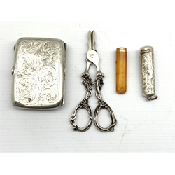 George V silver cheroot holder containing an amber and 9ct gold mounted cheroot holder, pair of silver grape scissors together with a George V silver cigarette case, Birmingham 1917 