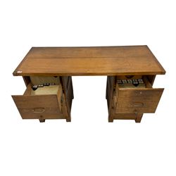 Hanningtons - mid-20th century oak twin pedestal desk, rectangular two-plank top, fitted with two filing cabinet drawers over two panelled cupboards, on square feet