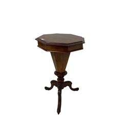 Victorian walnut sewing or work table, the octagonal hinged top with moulded edge, concealing fitted interior with central compartment, the octagonal pedestal tripod base with foliate and scroll carved cabriole supports