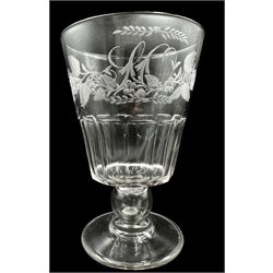 William IV large glass goblet with floral etched decoration and initialled 'L C', slice cut bucket shape bowl, the baluster stem inset with a silver four pence coin 1836 H18cm