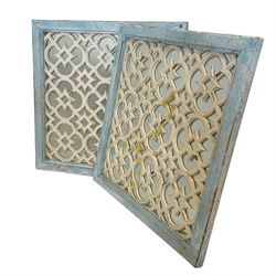 Pair wooden wall mirror, plain glass in square moulded frames and behind geometric fretwork, in distressed white and light blue finish 