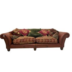 Tetrad - large two seat 'Eastwood' sofa, upholstered in buffalo hide leather with studwork, with Kilim chenille loose cushions, raised on turned feet