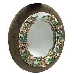 Late 19th century oval wall mirror, the porcelain frame decorated with applied flowers within a later surround 46cm x 42cm overall