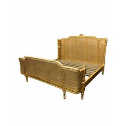 French style gilt and cane work Superior SuperKing 5' 10'' bedstead, with twist turned, floral and acanthus leaf carved column pilasters, on shaped and fluted feet
