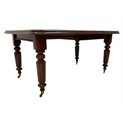 Early Victorian mahogany dining table, moulded rectangular telescopic extending top with rounded corners, with single additional leaf, on turned and reed carved supports, brass cups and castors, with winder 