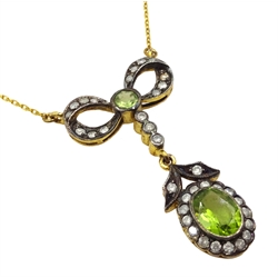 Peridot and diamond bow pendant, on gold chain necklace stamped 375