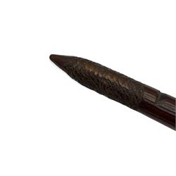 Australian Aboriginal hunting-throwing stick, of typical form with pointed swollen head and carved rough hatched grip, L61cm 