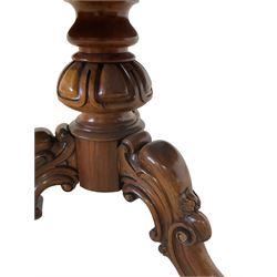Victorian figured walnut loo table, oval bookmatch veneer top with banded frieze, baluster pedestal with lobe carving, cabriole tripod base carved and moulded with flower head and C-scrolls