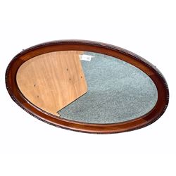 Early 20th century mahogany framed oval wall mirror with bevelled plate 78cm x 48cm