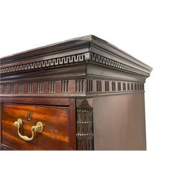 George III mahogany chest-on-chest, the entablature with projecting dentil cornice over triglyph and metope frieze, the upper section fitted with three short over three long drawers flanked by fluted quarter columns with Corinthian columns, base with three graduating cock-beaded drawers, lower moulded edge over bracket feet