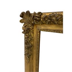 Victorian gilt framed wall mirror, the corners applied with moulded acanthus leaves and rose garlands, with an ornate slip