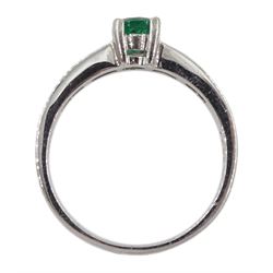 Platinum round emerald ring, with baguette diamond channel set shoulders, stamped PT950